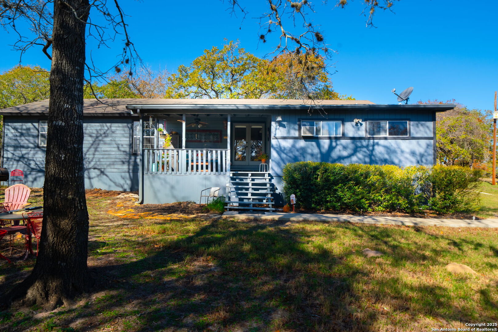 119 Post Oak Road La Vernia, TX 78121 - Photo 28 of 38 a front view of a house with a garden