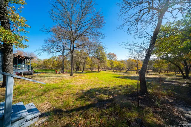 a view of yard with swimming pool