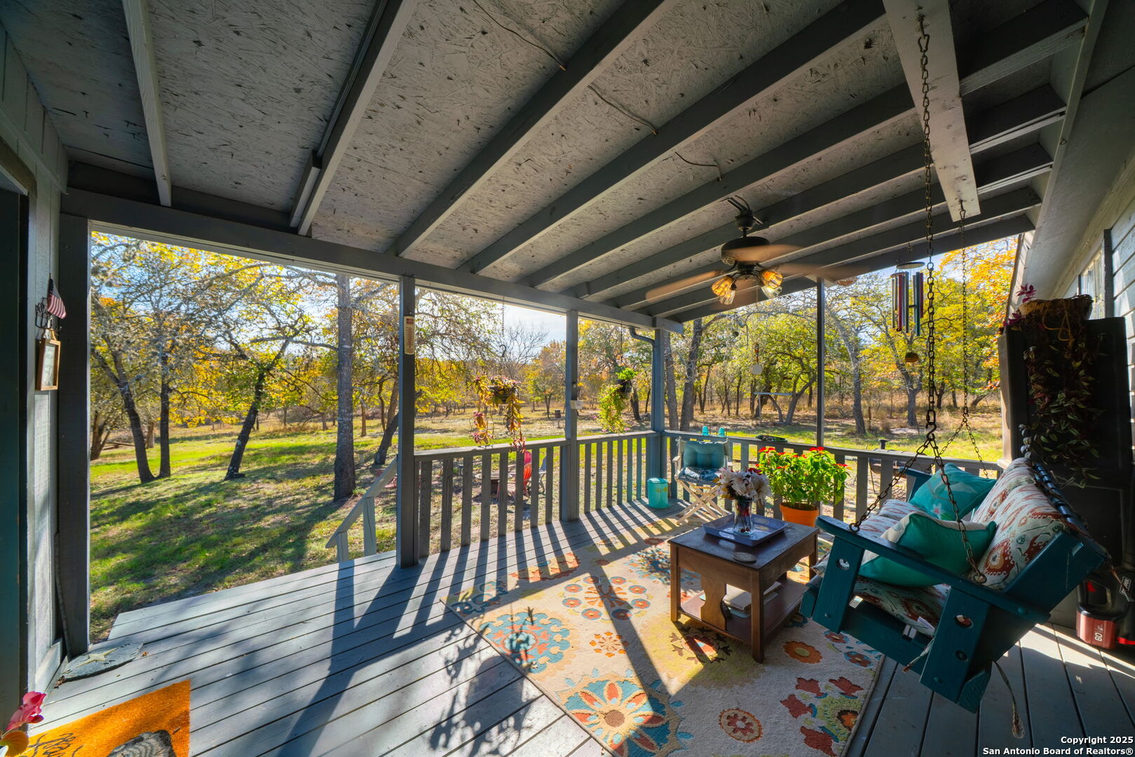 119 Post Oak Road La Vernia, TX 78121 - Photo 3 of 38 a view of balcony with couch and wooden floor