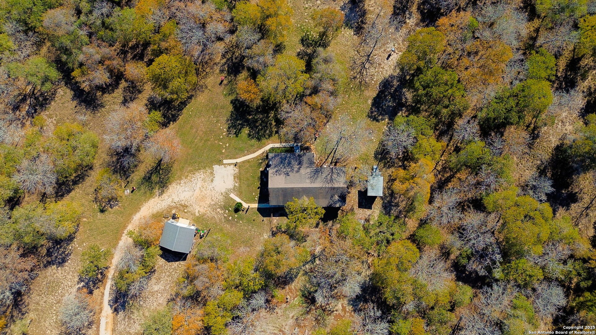 119 Post Oak Road La Vernia, TX 78121 - Photo 32 of 38 a picture of trees in front of house