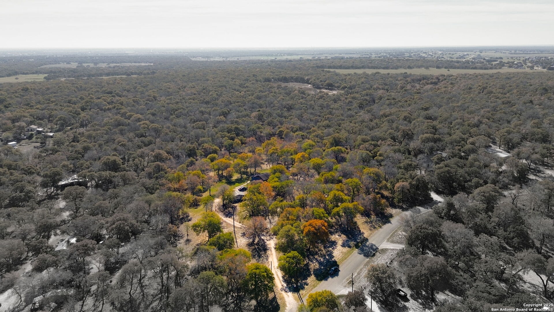 119 Post Oak Road La Vernia, TX 78121 - Photo 35 of 38 an aerial view of house with yard and mountain view in back