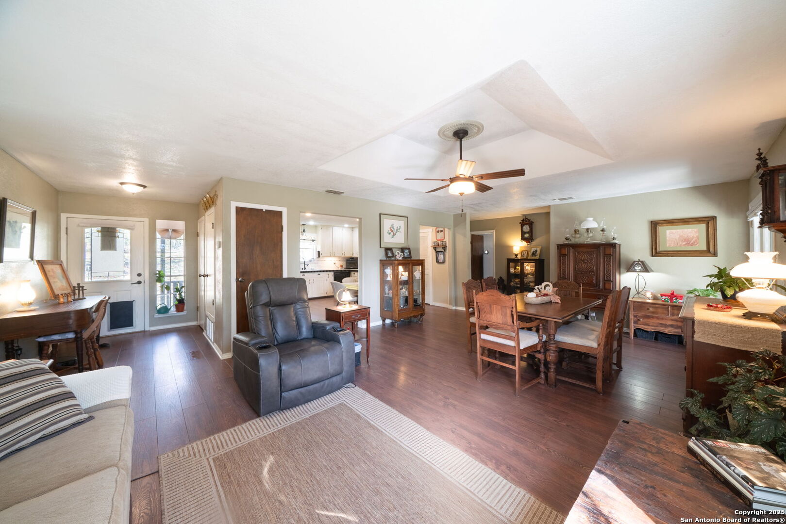 119 Post Oak Road La Vernia, TX 78121 - Photo 4 of 38 a living room with furniture kitchen view and a wooden floor