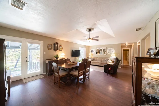 a view of a livingroom with furniture window and wooden floor