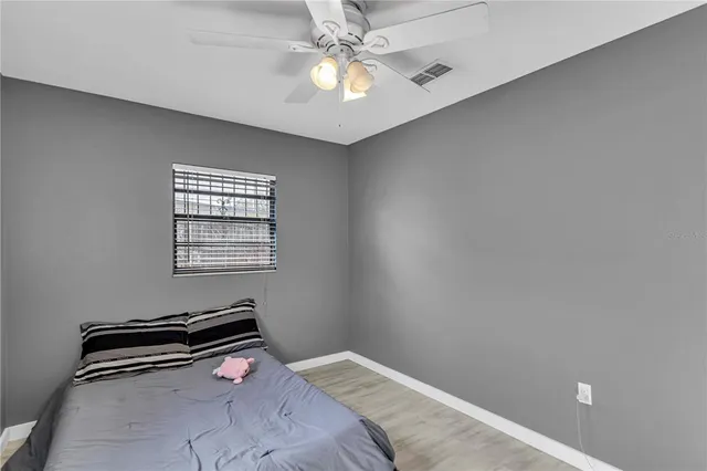 a room with a bed and a window