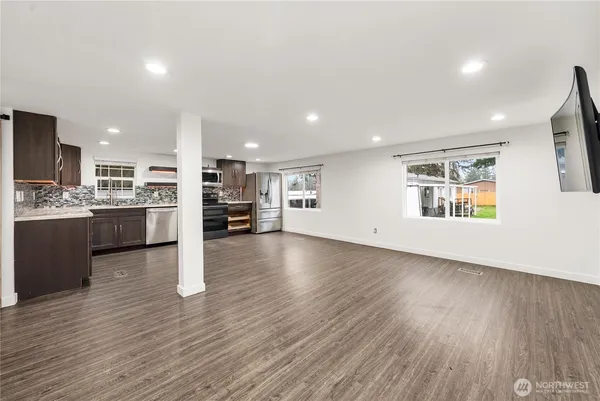 a view of entryway with wooden floor and stairs