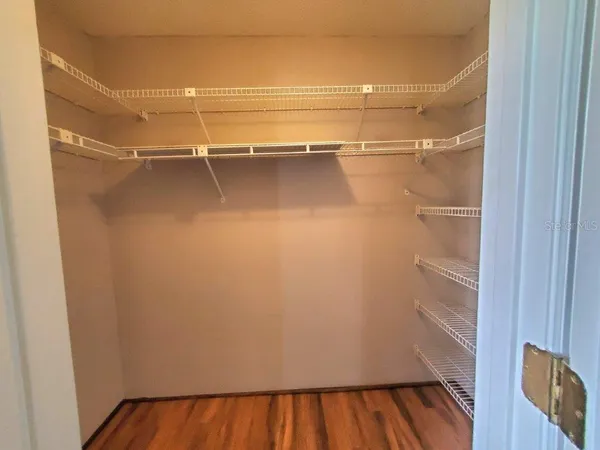 a view of a room with racks on the wall