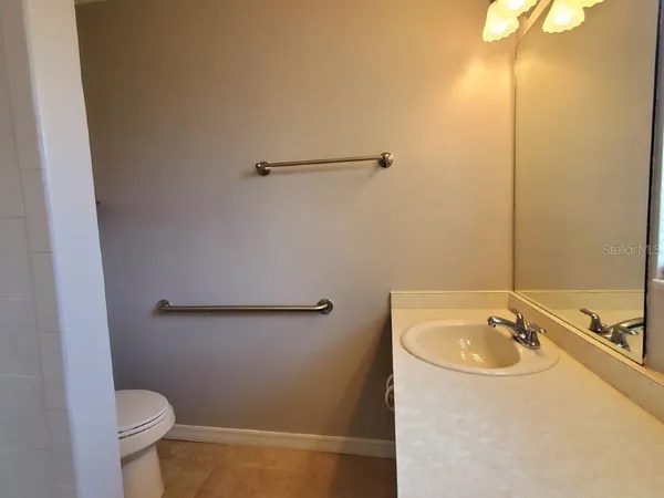 a bathroom with a sink and toilet