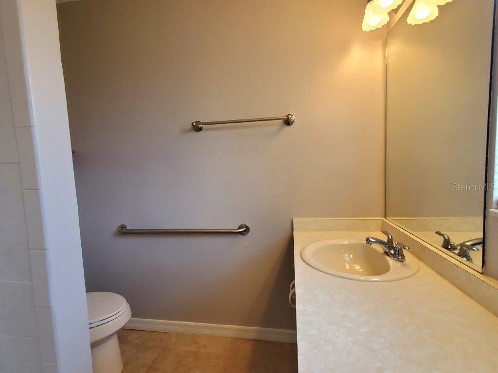 26014 Ocelot Lane Punta Gorda, FL 33983 - Photo 26 of 35 a bathroom with a sink and toilet