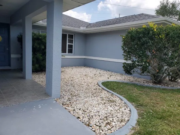 a view of a backyard of the house