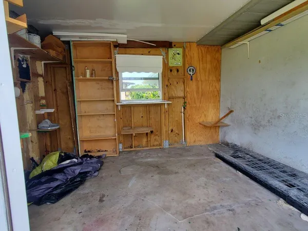 a view of a room with wooden walls