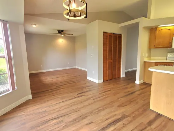 a view of a livingroom with wooden floor