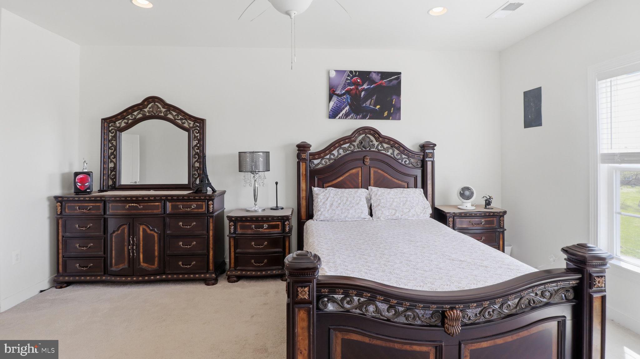 11502 Aden Road Nokesville, VA 20181 - Photo 62 of 106 a living room with furniture a flat screen tv and a dresser