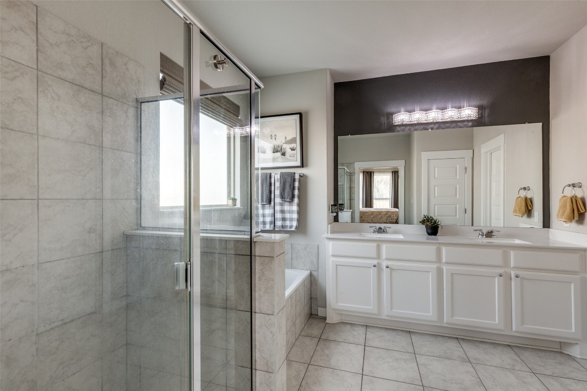 125 Syrah Court Leander, TX 78641 - Photo 16 of 25 a bathroom with a sink vanity and a mirror