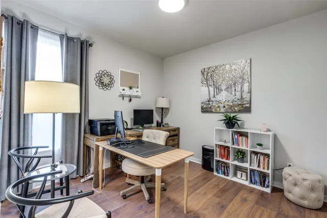 a workspace with furniture and window