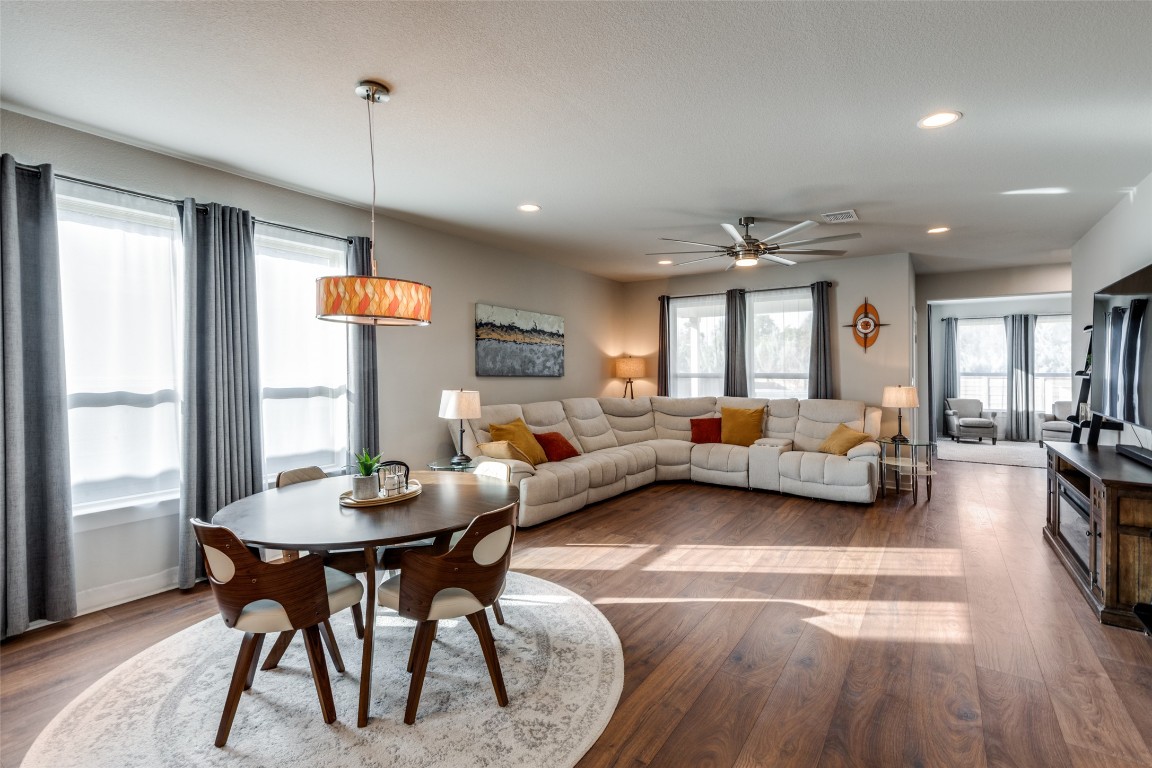 125 Syrah Court Leander, TX 78641 - Photo 5 of 25 a living room with furniture a large window and a wooden floor