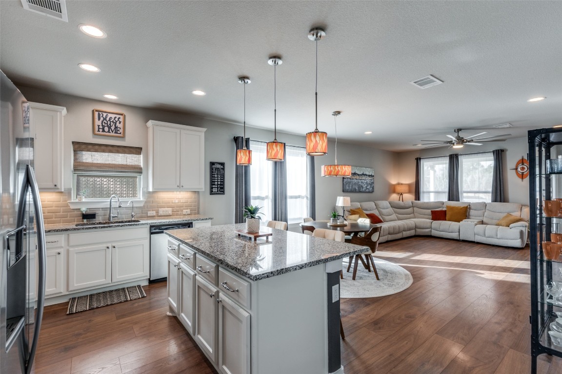 125 Syrah Court Leander, TX 78641 - Photo 9 of 25 a kitchen with sink stove and cabinets