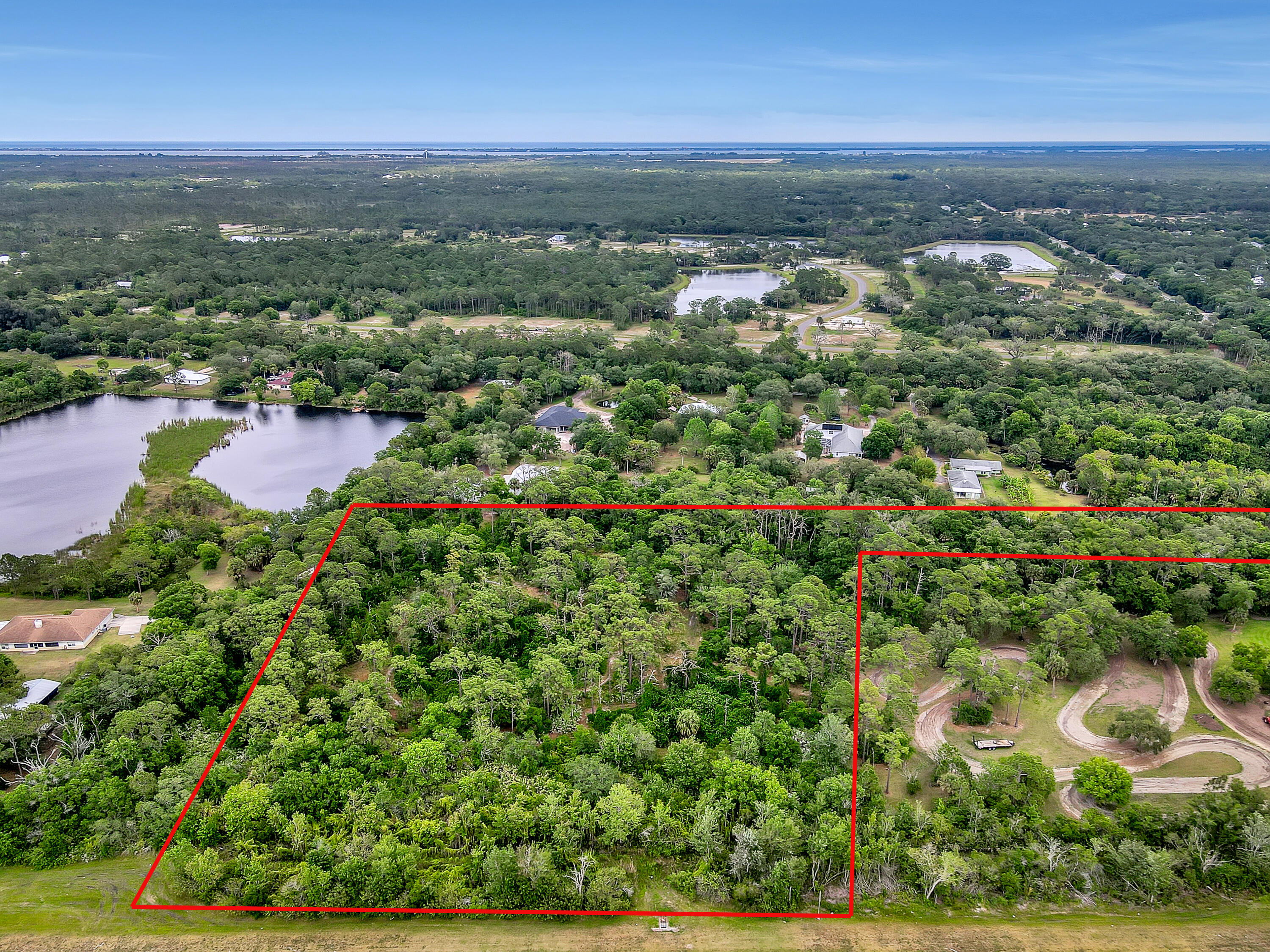 0 Valkaria Road Malabar, FL 32950 - Photo 15 of 17 an aerial view of residential houses with outdoor space and trees