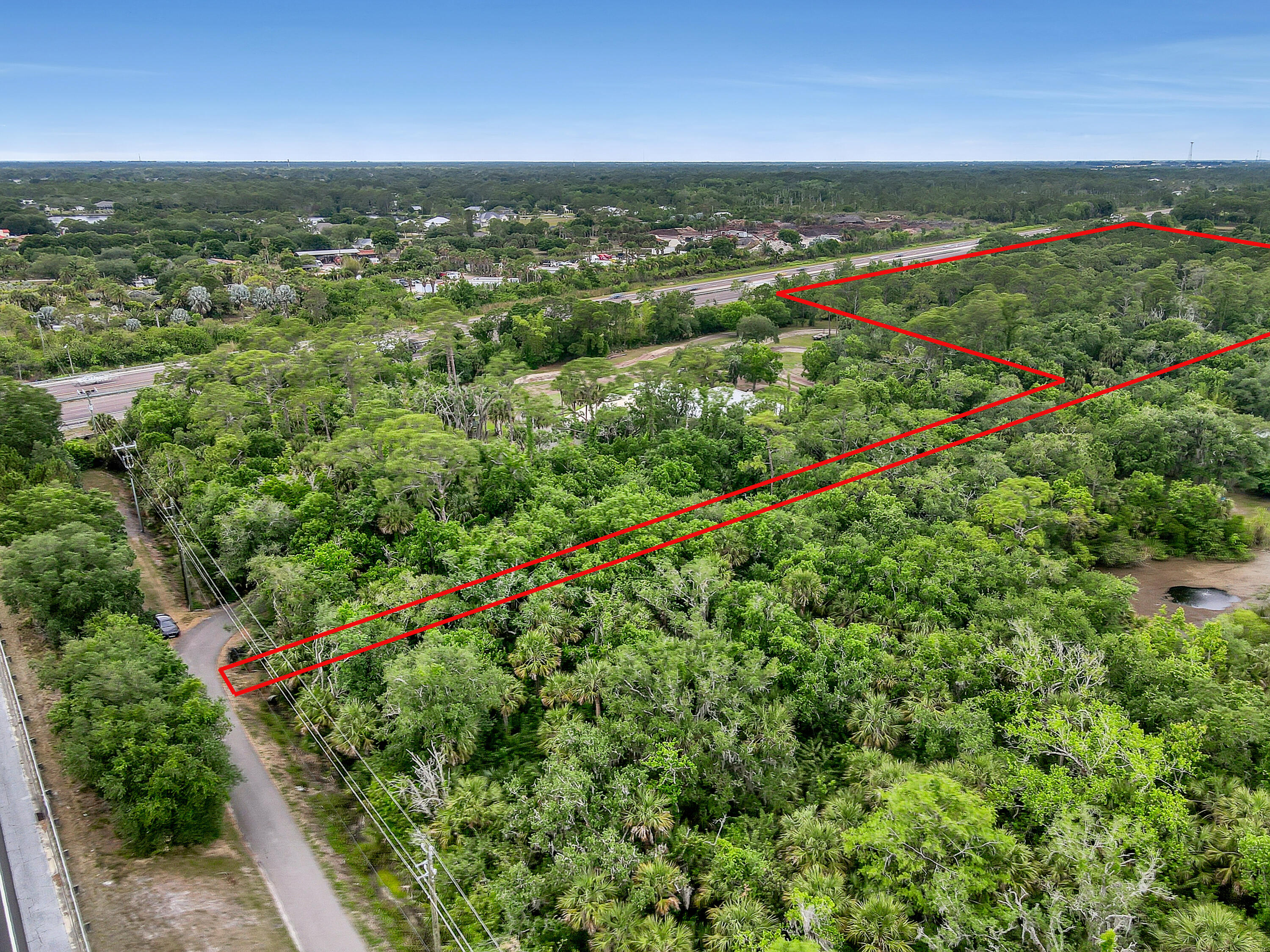 0 Valkaria Road Malabar, FL 32950 - Photo 16 of 17 an aerial view of residential houses with outdoor space and trees