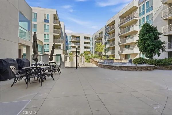 a couple of table and chairs in front of building