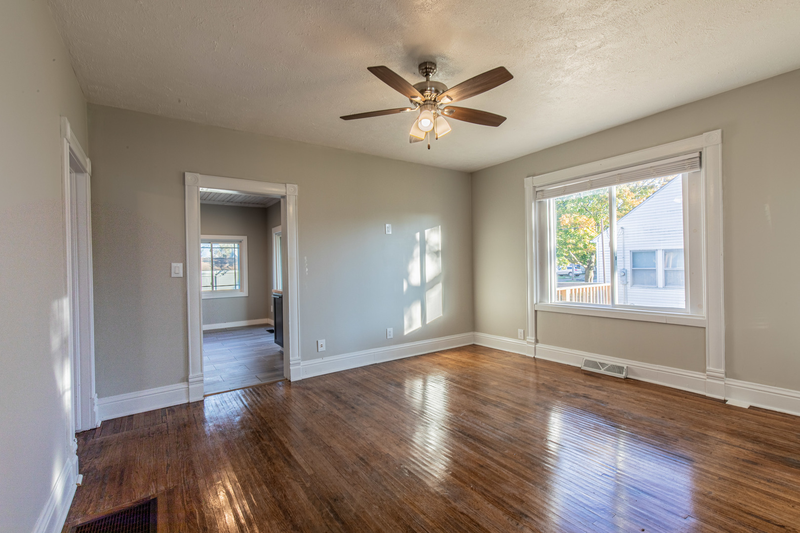 15 South Vernon Street Princeton, IL 61356 - Photo 12 of 28 a view of an empty room with wooden floor and a window