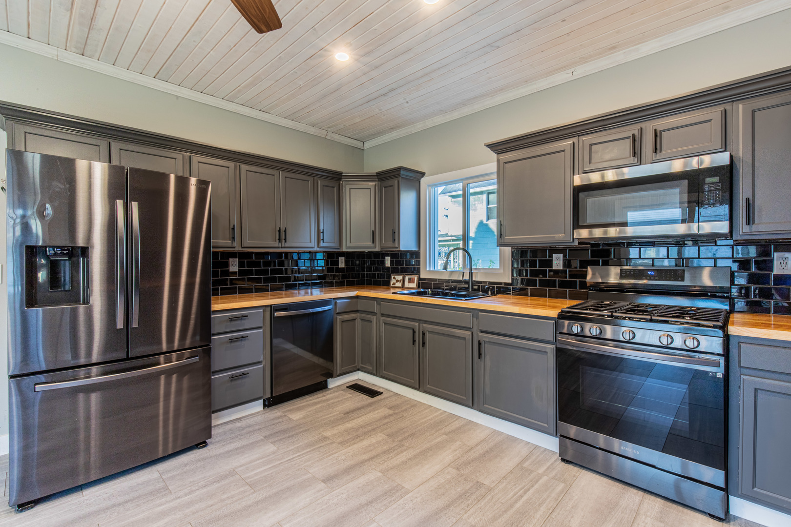 15 South Vernon Street Princeton, IL 61356 - Photo 14 of 28 a kitchen with granite countertop stainless steel appliances and wooden cabinets