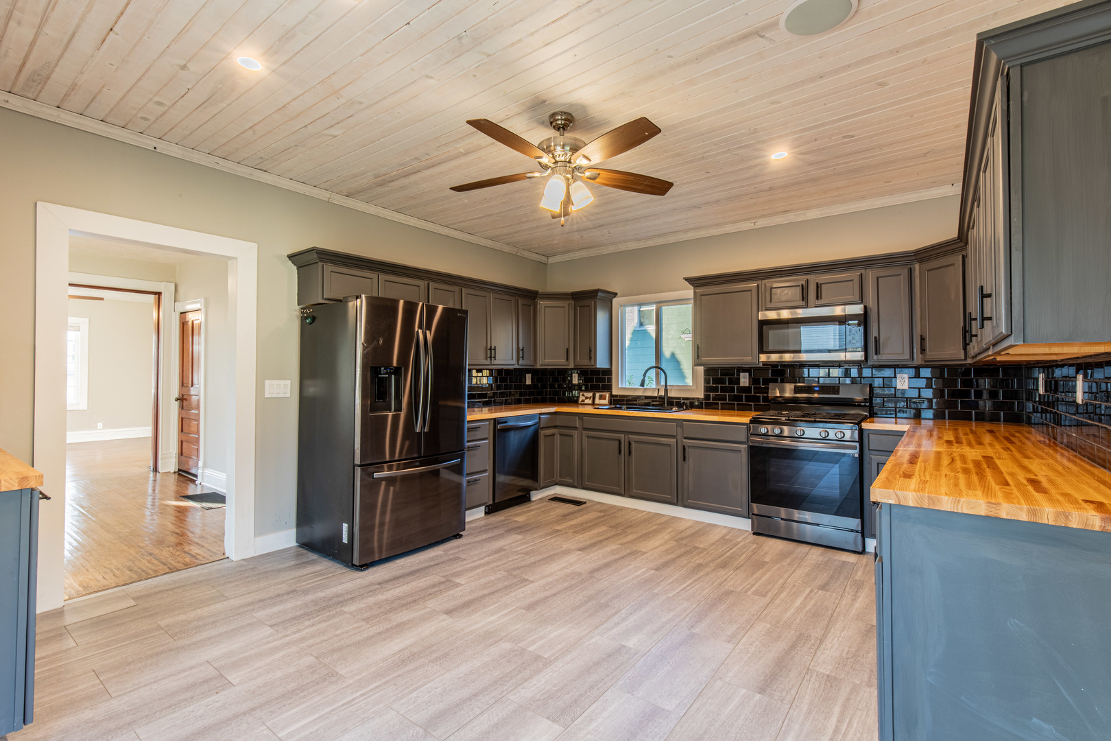 15 South Vernon Street Princeton, IL 61356 - Photo 16 of 28 a kitchen with stainless steel appliances kitchen island granite countertop a refrigerator a stove top oven a sink and dishwasher