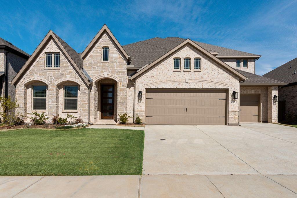 809 Turnbull Avenue Justin, TX 76247 - Photo 1 of 22 a front view of a house with a yard