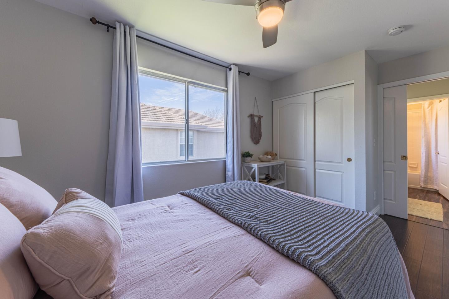 25215 Azalea Court Salinas, CA 93908 - Photo 36 of 48 a bedroom with a large bed and a chandelier