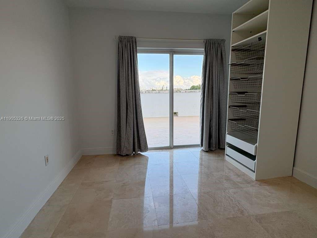 1627 Southwest 37th Avenue, Unit 207 Miami, FL 33145 - Photo 12 of 24 an empty room with a window