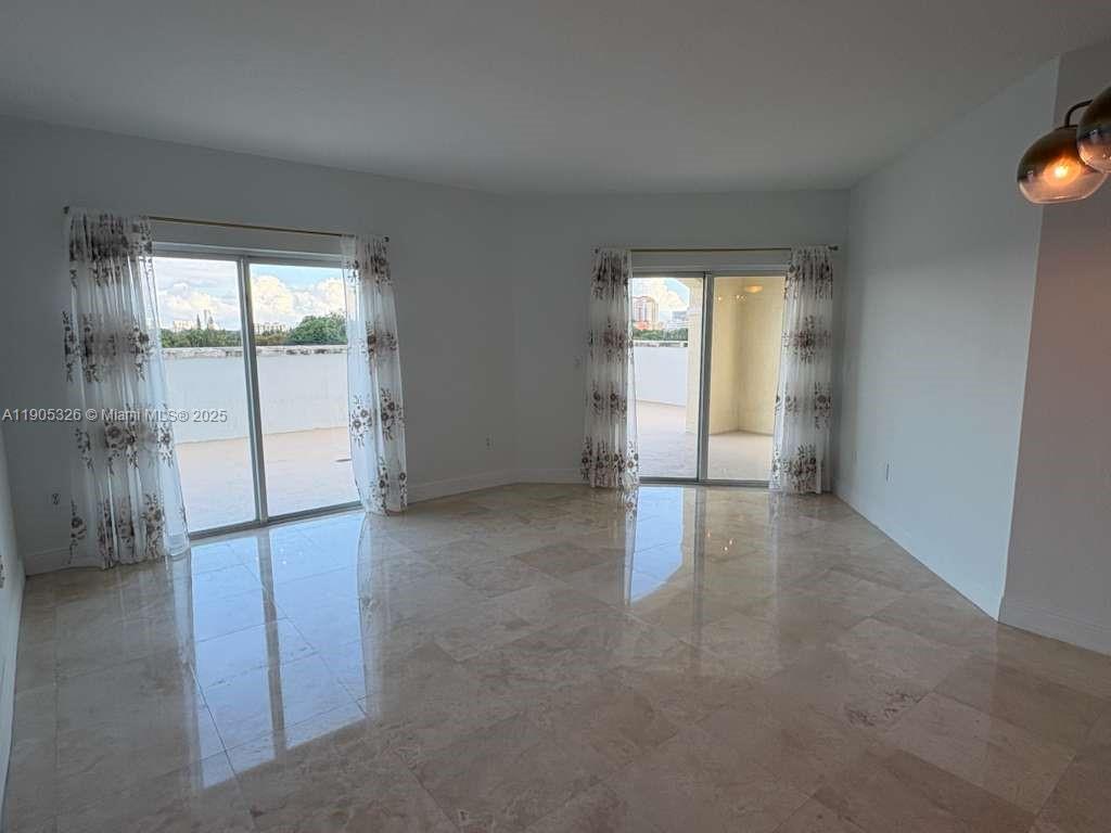 1627 Southwest 37th Avenue, Unit 207 Miami, FL 33145 - Photo 13 of 24 an empty room with windows