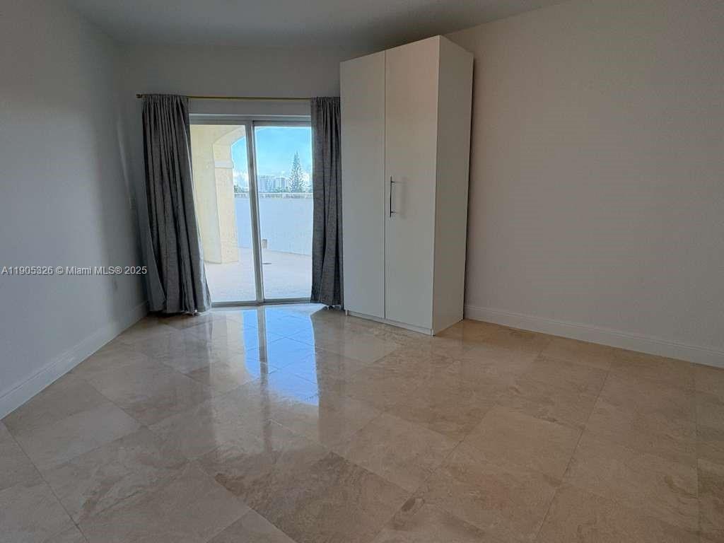1627 Southwest 37th Avenue, Unit 207 Miami, FL 33145 - Photo 15 of 24 an empty room with windows