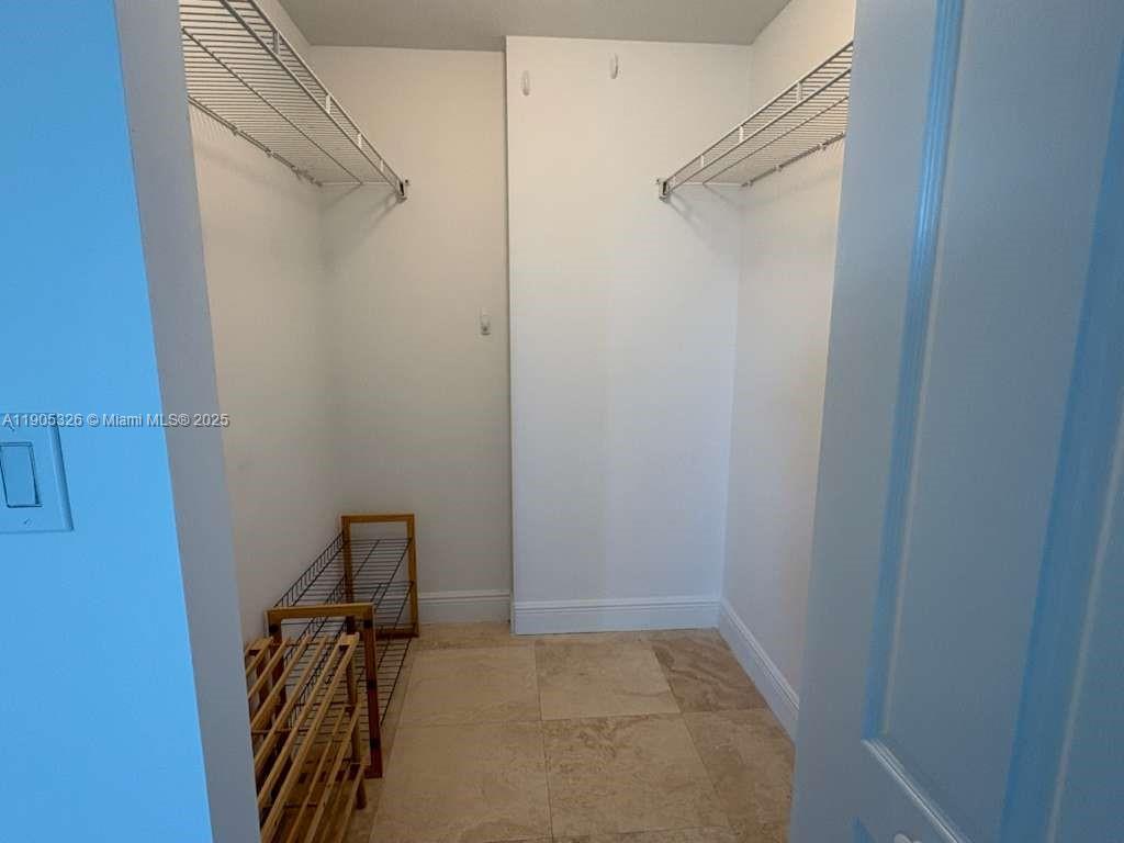1627 Southwest 37th Avenue, Unit 207 Miami, FL 33145 - Photo 16 of 24 a view of a room with racks on the wall