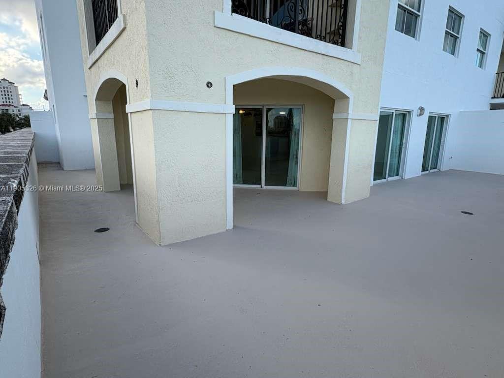 1627 Southwest 37th Avenue, Unit 207 Miami, FL 33145 - Photo 18 of 24 a view of a hallway with windows and entryway