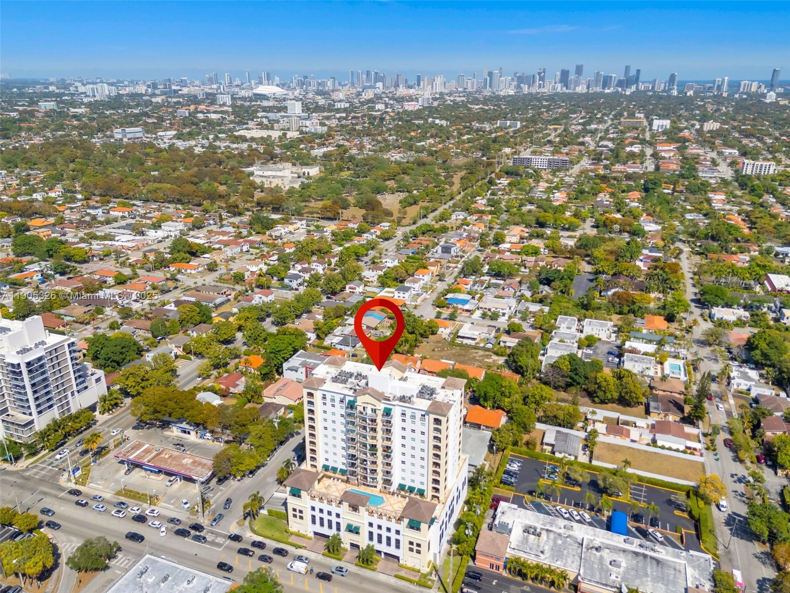 1627 Southwest 37th Avenue, Unit 207 Miami, FL 33145 - Photo 2 of 24 an aerial view of city and parking space