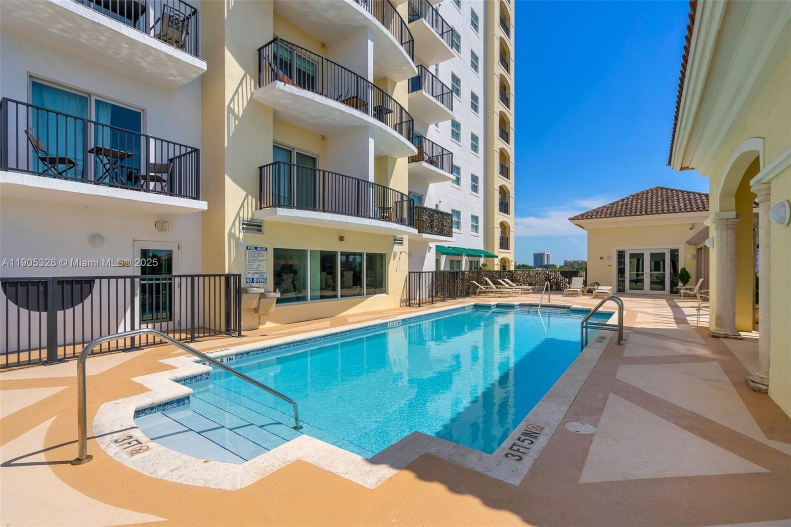 1627 Southwest 37th Avenue, Unit 207 Miami, FL 33145 - Photo 22 of 24 a view of a building with a swimming pool