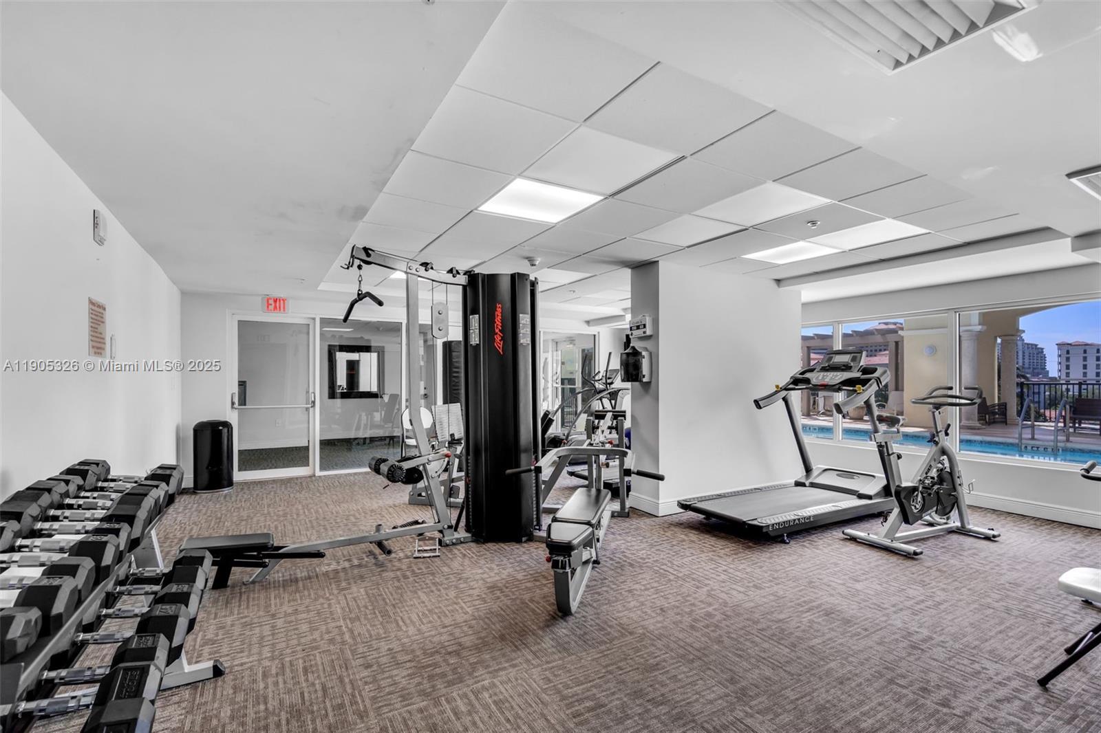 1627 Southwest 37th Avenue, Unit 207 Miami, FL 33145 - Photo 23 of 24 a view of a room with gym equipment
