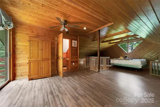 a view of a room with wooden walls