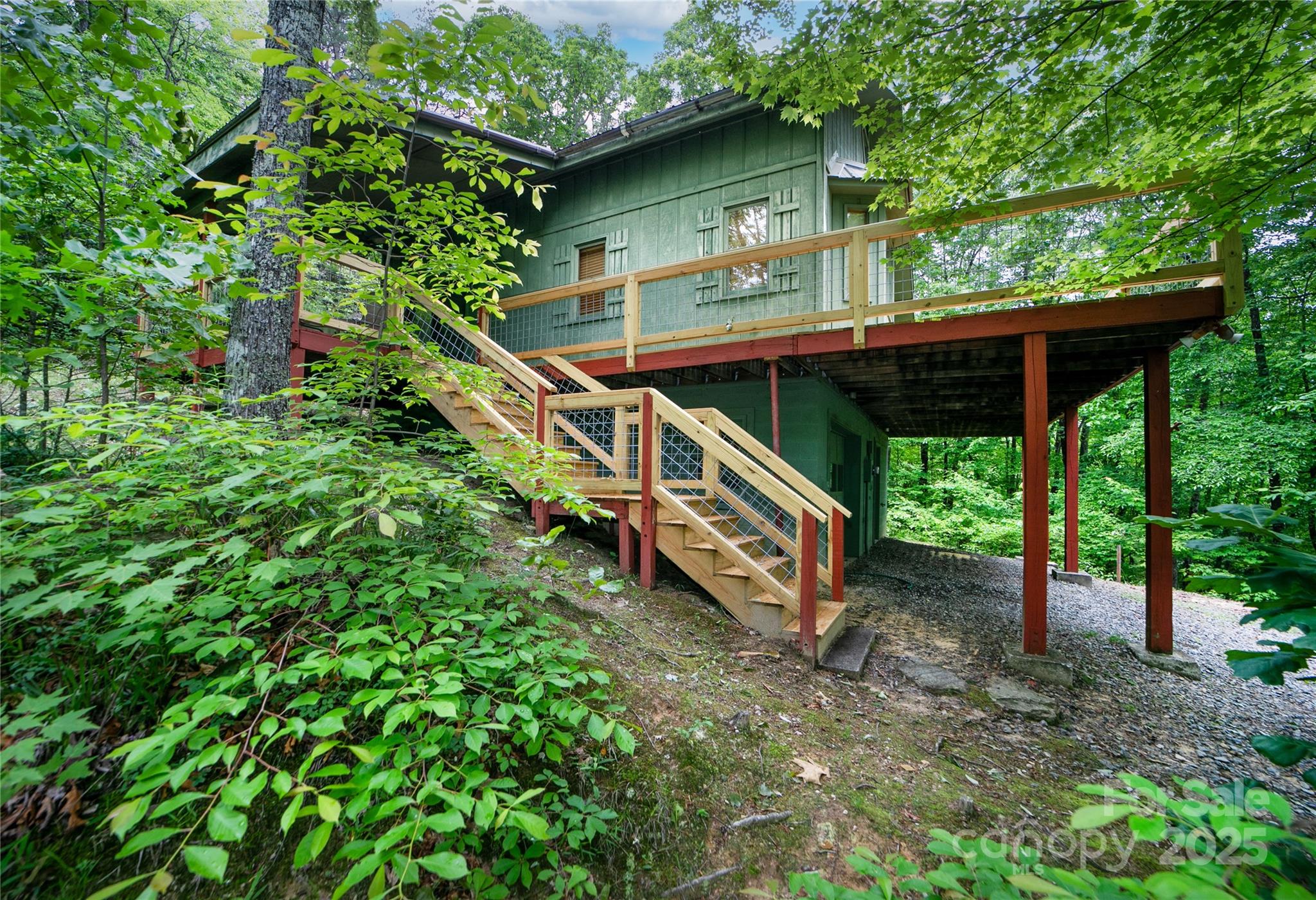 261 Franks Cove Road Brevard, NC 28712 - Photo 2 of 34 a backyard of a house with seating space