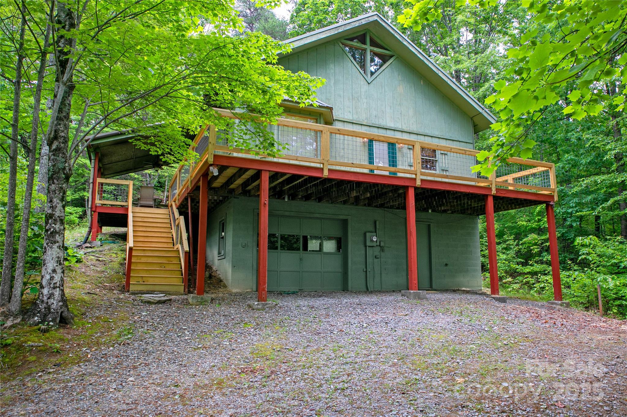261 Franks Cove Road Brevard, NC 28712 - Photo 25 of 34 a front view of a house with a garden
