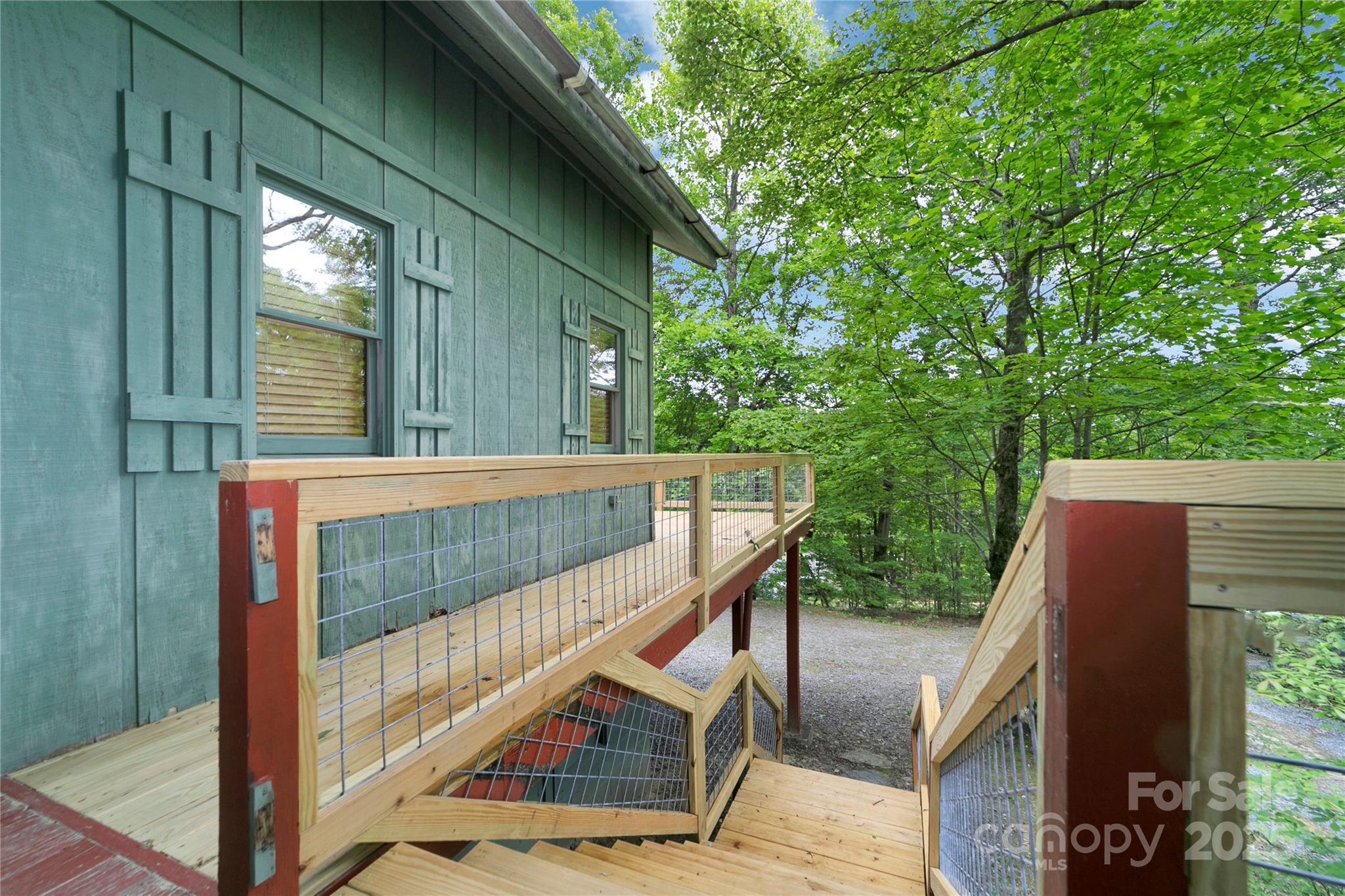 261 Franks Cove Road Brevard, NC 28712 - Photo 32 of 34 a view of balcony with wooden floor and fence