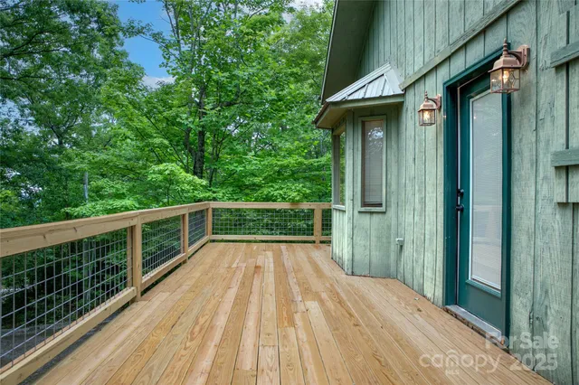 a view of a porch with furniture and a yard