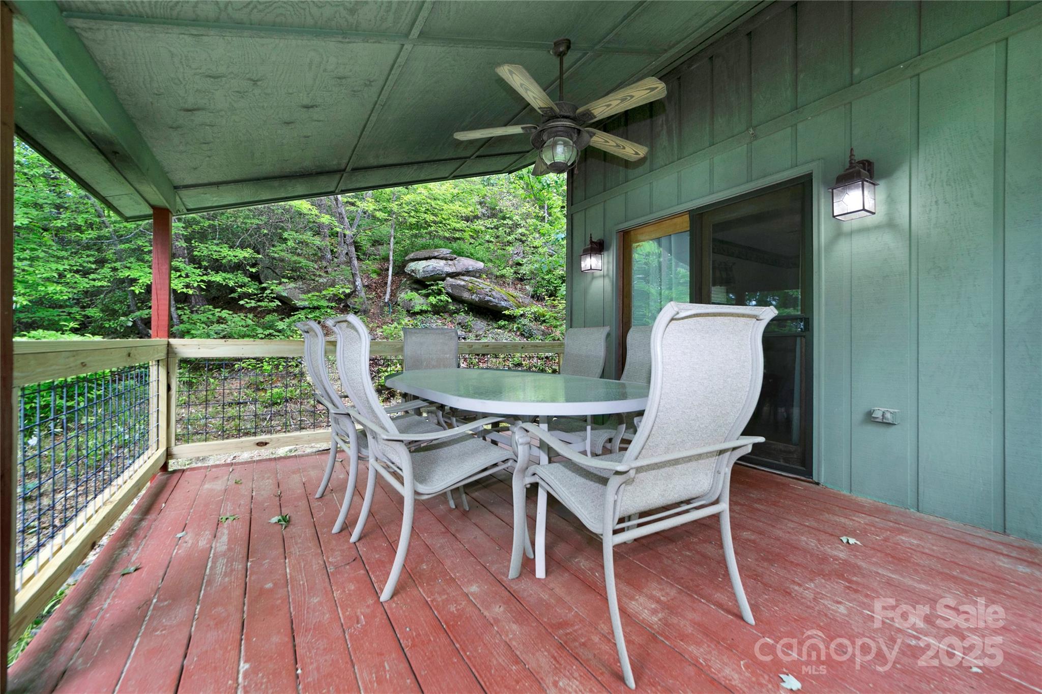 261 Franks Cove Road Brevard, NC 28712 - Photo 7 of 34 a view of a porch with furniture and a yard