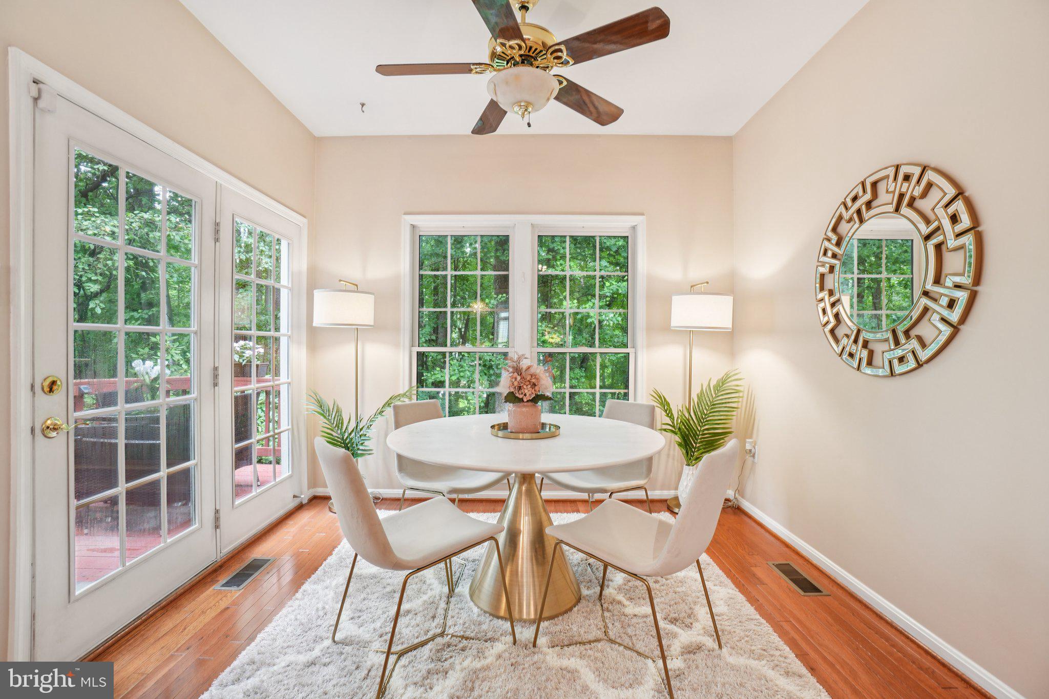 11742 Valley Ridge Circle Fairfax, VA 22033 - Photo 12 of 34 a dining room with furniture a rug and a large window