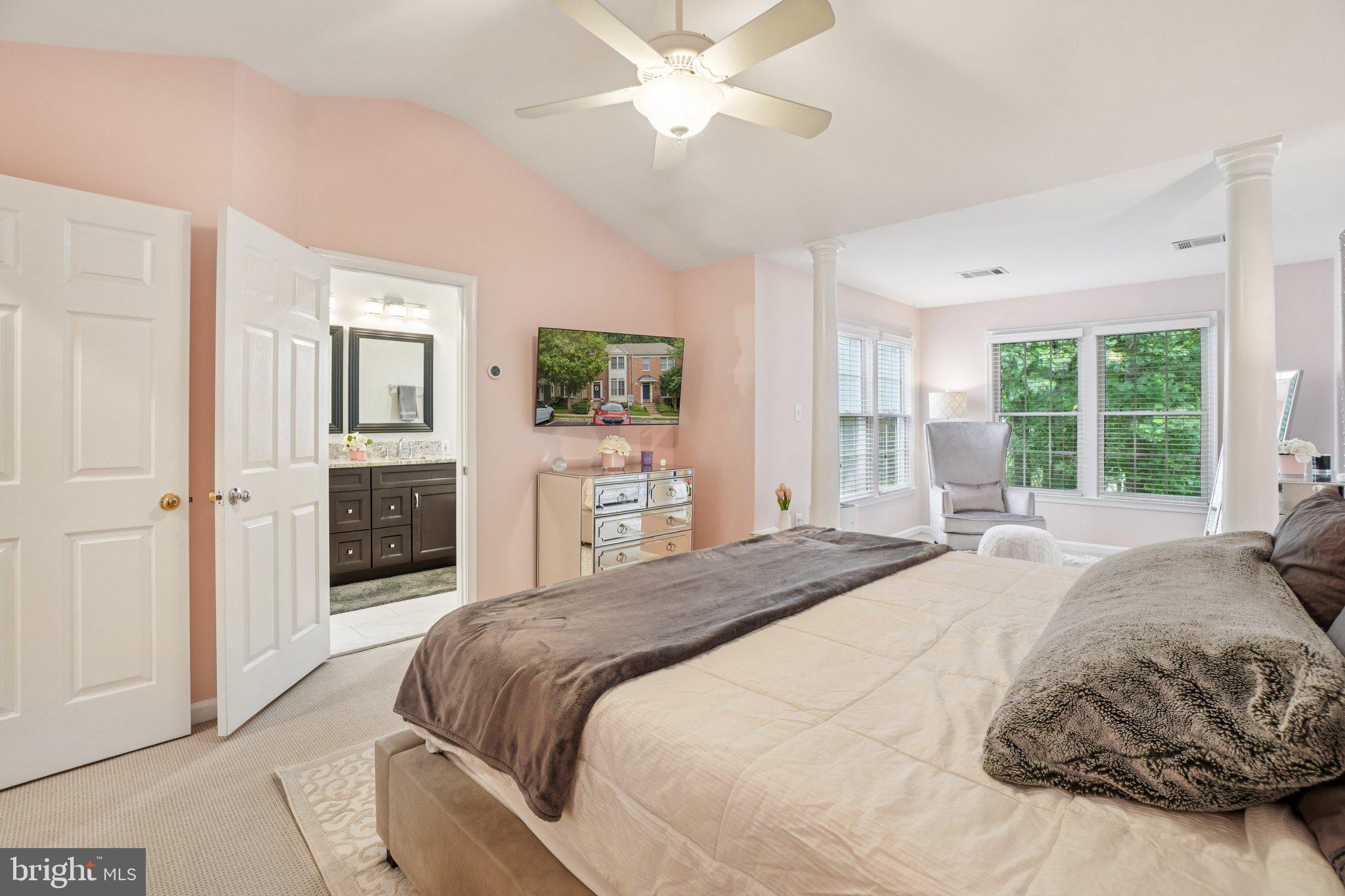 11742 Valley Ridge Circle Fairfax, VA 22033 - Photo 14 of 34 a spacious bedroom with a bed and a large window