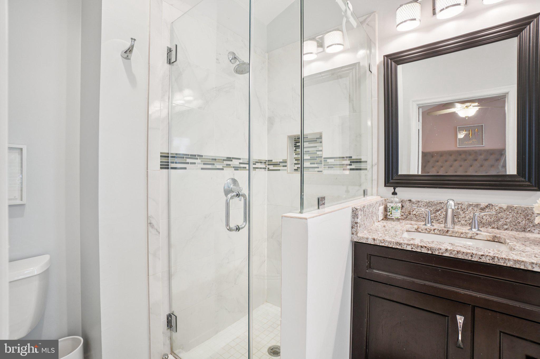 11742 Valley Ridge Circle Fairfax, VA 22033 - Photo 18 of 34 a bathroom with a double vanity sink mirror and double