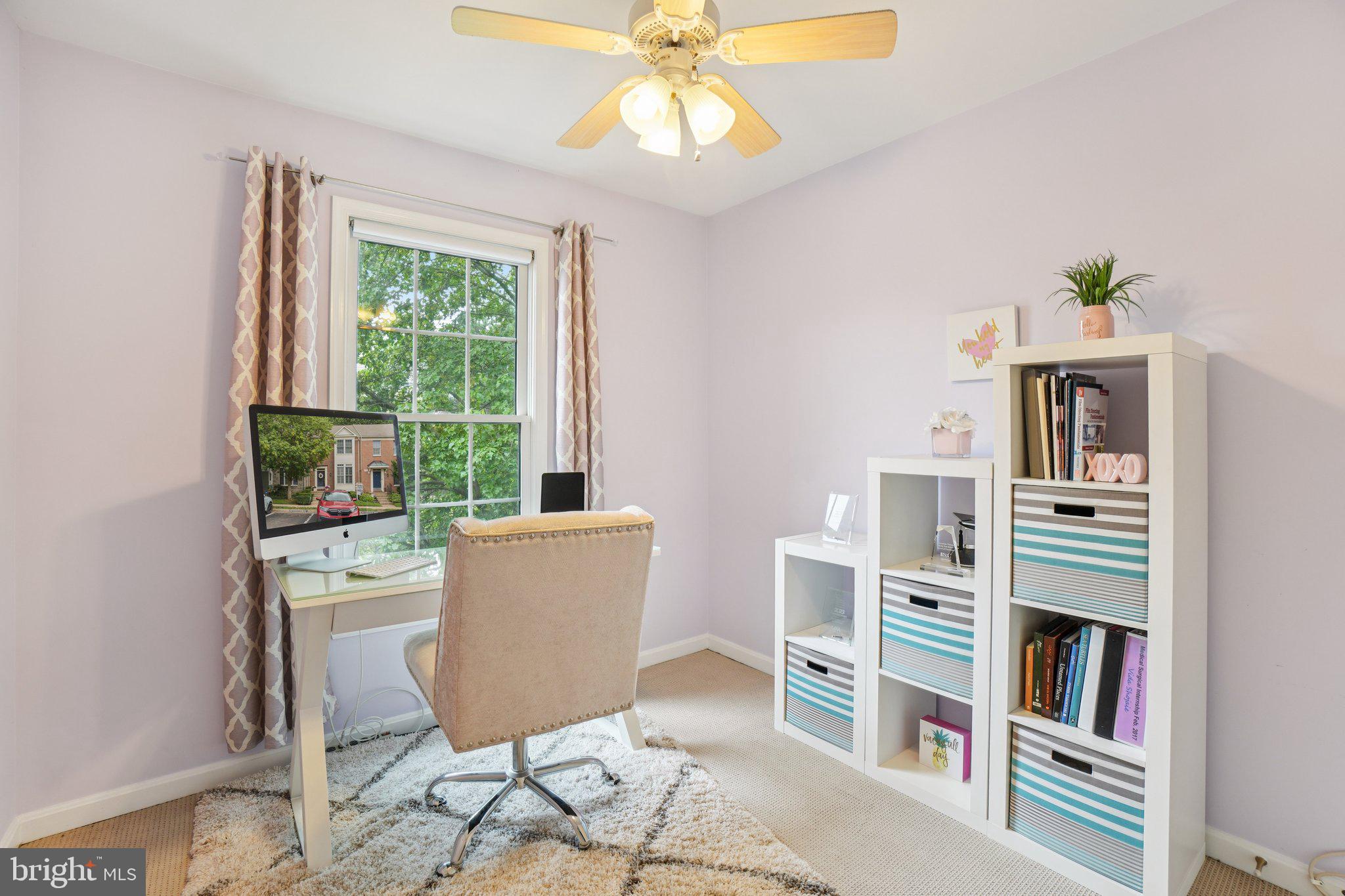 11742 Valley Ridge Circle Fairfax, VA 22033 - Photo 19 of 34 a living room with furniture and a book shelf