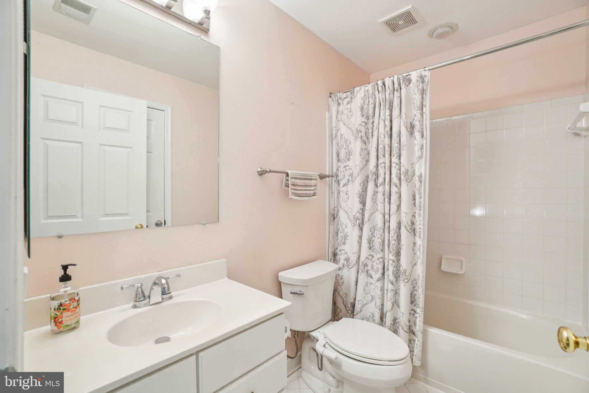 11742 Valley Ridge Circle Fairfax, VA 22033 - Photo 21 of 34 a bathroom with a sink toilet and shower