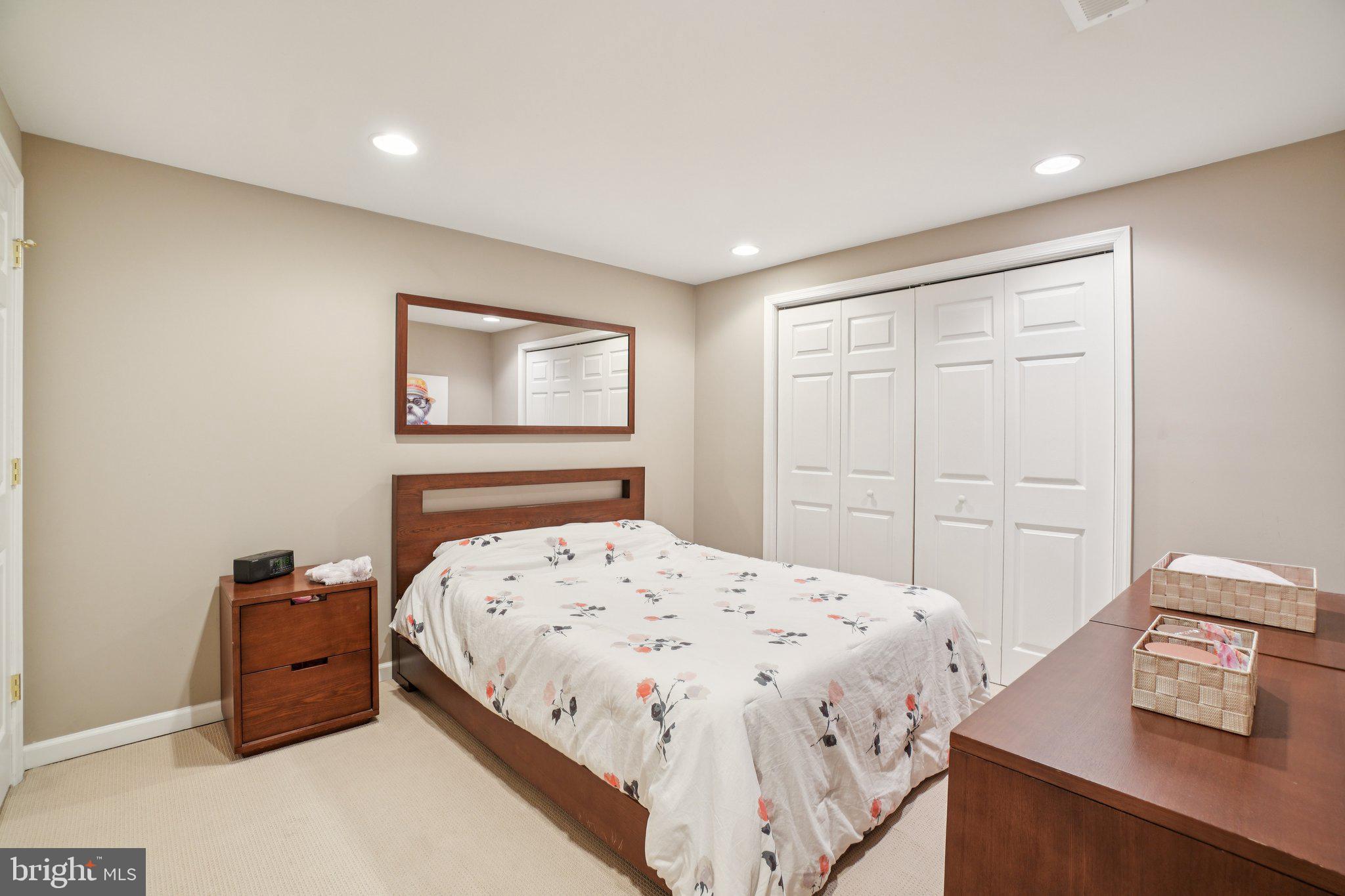 11742 Valley Ridge Circle Fairfax, VA 22033 - Photo 27 of 34 a bedroom with a bed and a window