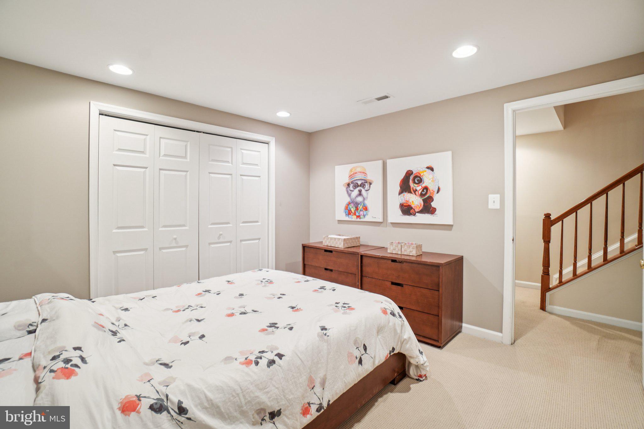 11742 Valley Ridge Circle Fairfax, VA 22033 - Photo 28 of 34 a bedroom with a bed and a dresser