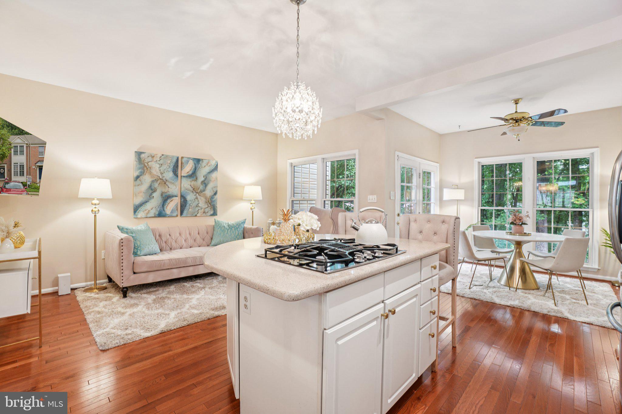 11742 Valley Ridge Circle Fairfax, VA 22033 - Photo 7 of 34 a living room with furniture a dining table and a chandelier